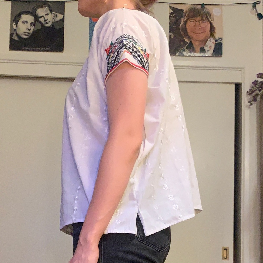 Beautiful white top with colorful stitching